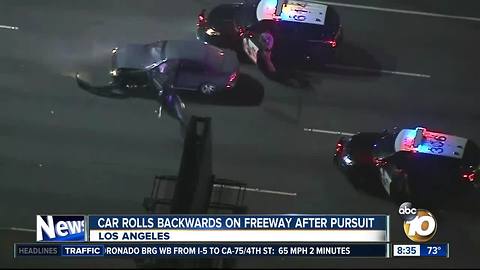 Car rolls backwards on freeway after pursuit, Los Angeles