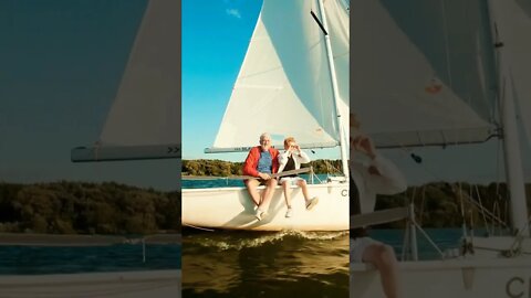 Grandson Sailing With Grandfather