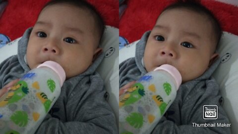 Cute baby with bottle