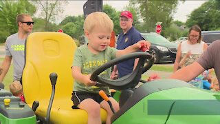 People learn about equipment used by local businesses, government at Touch-A-Truck event