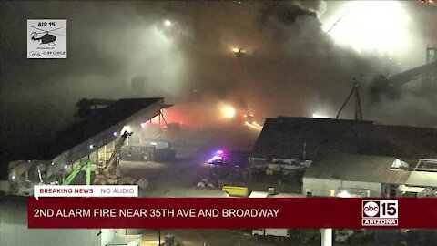 Second-alarm scrap metal fire burning near 35th Ave and Broadway