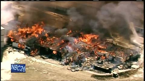 Post-explosion, apartment building burned