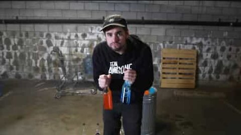 Artist plays song using bottles