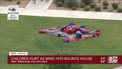 Four children hospitalized after bounce house is picked up by wind in Mesa