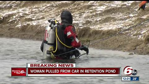 Car crashes into retention pond on city's SE side; woman pulled from water