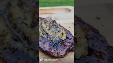 NY strip seared on the Camp Chef sear box after smoking for a bit.Topped with a smoked garlic spread