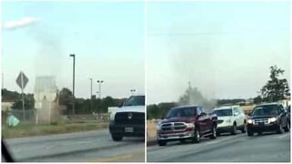 Dust Devil crosses the road