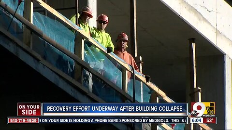 Crews bring in heavy equipment to assist in the recovery efforts at the downtown Cincinnati building collapse