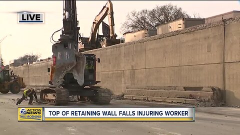 Top of retaining wall falls injuring worker