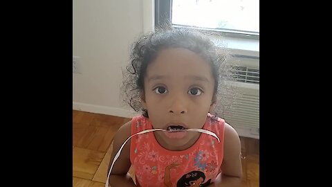 Little Girl Does Exercise Routine To Pull Loose Tooth