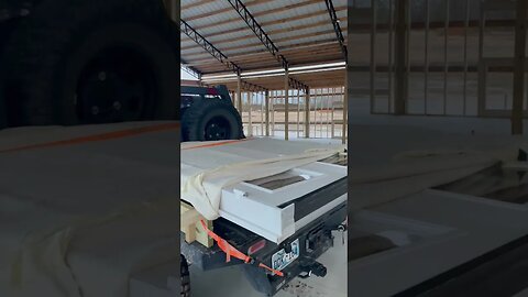 Hauling a French door on a flatbed truck