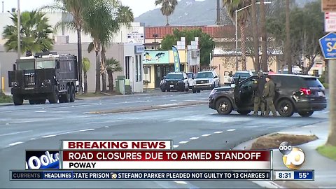 Road closed due to armed standoff