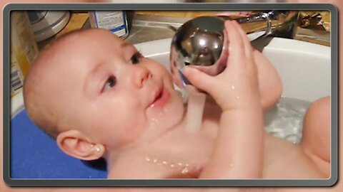 Cute baby playing with water video