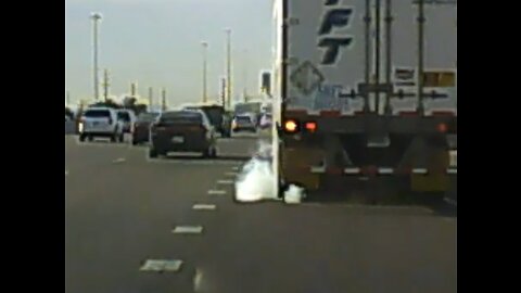 Semi Truck runs over median then tire explodes after he enters the Interstate