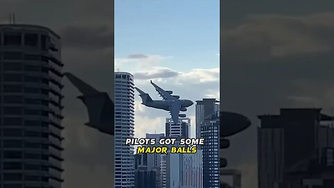 HUGE Aircraft Flies Through CITY Skyline