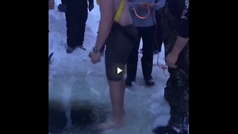 Guy loses his phone in a frozen lake so his friends help him retrieve it