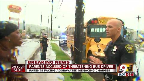 Parents accused of threatening bus driver