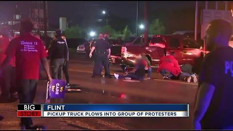 Vehicle plows into crowd of demonstrators during fast food worker strike in Flint