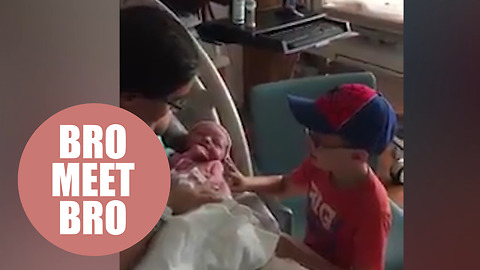 Nervous mom watches her autistic five-year-old meet his baby brother for the first time