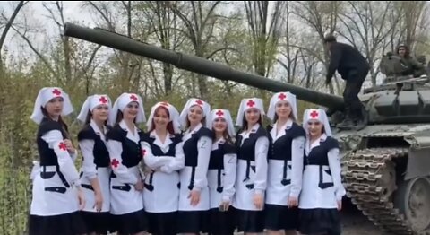 Sisters Of Victory (Girl Band ) giving cake to Russian soldiers