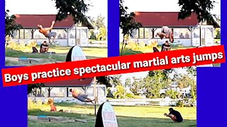 Young practice spectacular martial arts jumps