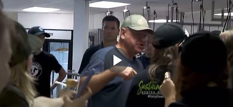 Tim Walz distributes ice cream and malts at the Minnesota State Fair's Dairy Building.