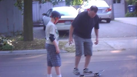 "Father and Son Bonding Time: A Skateboard Fail"