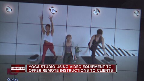 Yoga studio using video equipment to offer remote instructions to clients