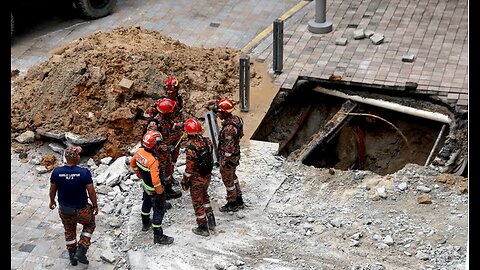 SINKHOLE OPENS UP, SWALLOWS WOMAN IN KUALA LUMPUR MALAYSIA