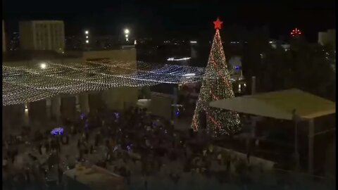 A giant Christmas tree is lit in Bethlehem Square