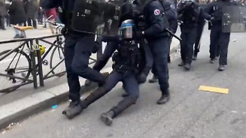 WOMAN COP ( PONY TAIL POLICE ) FAINTS WHEN A ROCK IS THROWN AT HER DURING A PROTEST IN FRANCE