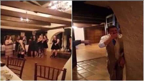 Woman catches wedding bouquet and her boyfriend's reaction is hilarious!