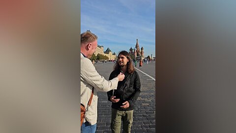 An Irishman interviews a Frenchman at the Russian "Red Square"