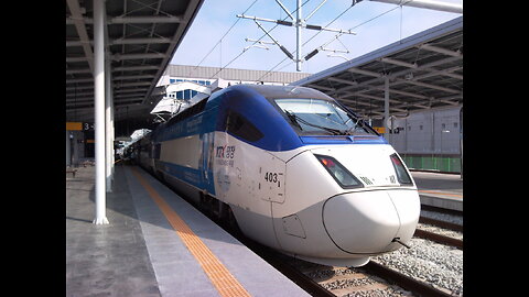 KOREAN BULLET TRAIN KTX CROSSING THE MAIN ROAD