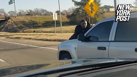 Friday fail! Man clings to SUV hood going 70 mph