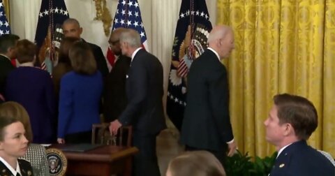 Joe Biden wanders around in crowd looking totally lost while everyone completely ignores him