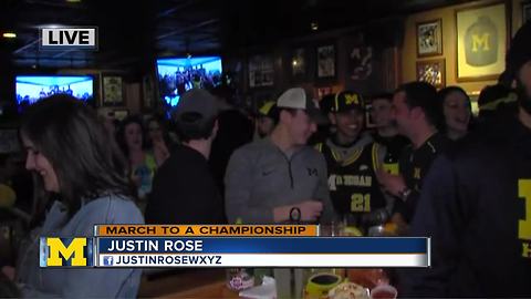 Michigan fans cheer on the team in the Final Four