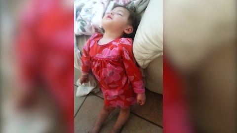 "A Tot Girl Sleeps Standing Up"