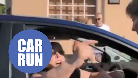 Frustrated woman drives into a half marathon and is stopped by runners