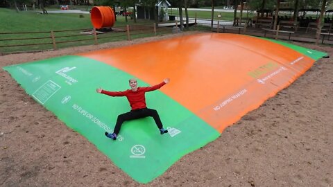 GIANT SLIPPERY TRAMPOLINE IN THE RAIN!