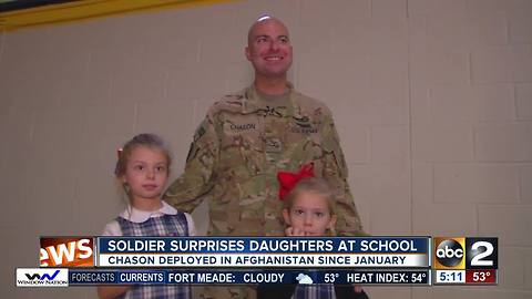 Soldier surprises daughters in school for Veteran's Day Assembly