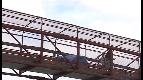 Homeless camp taking over pedestrian bridge in east Las Vegas