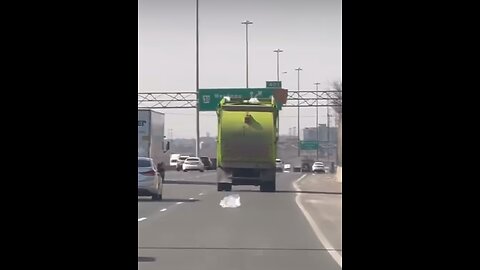 Garbage Truck Tossing Garbage On Highway