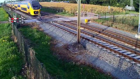 Cyclist escapes death on unguarded train level crossing