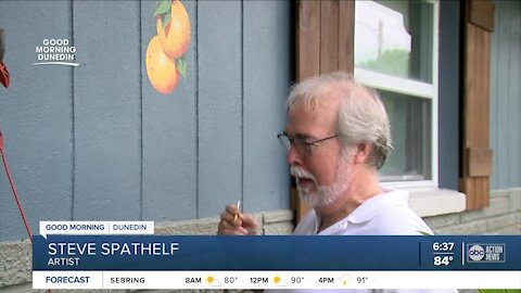 Local artist paints oranges on hundreds of Dunedin homes