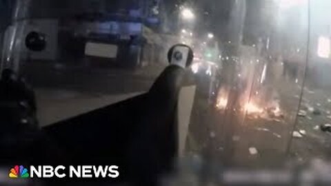 Bodycam footage shows U.K. police being pelted with fireworks during riots