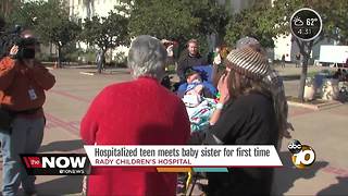 Hospitalized teen meets baby sister for first time