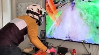 Guy mountainbikes indoors because of quarantine