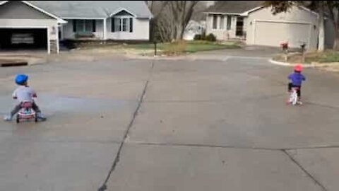 Little girl crashes bike into garage