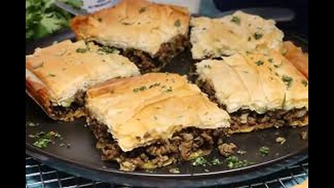 Meat pie with spices, lettuce and cream